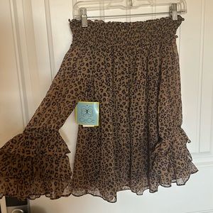 Leopard blouse over shoulders